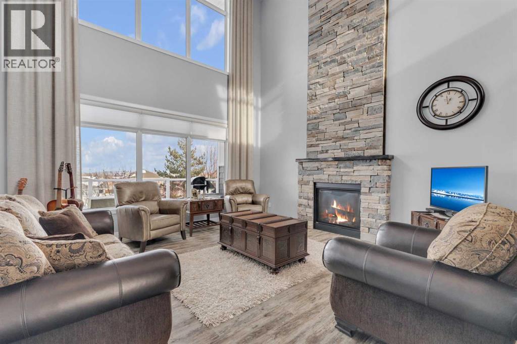 5 Leonard Close, Sylvan Lake, AB - Indoor Photo Showing Living Room With Fireplace