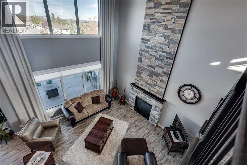 5 Leonard Close, Sylvan Lake, AB - Indoor With Fireplace