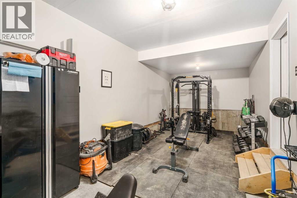 915 Crestridge Common Sw, Calgary, AB - Indoor Photo Showing Gym Room