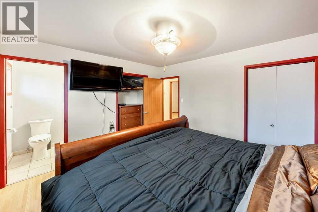 9136 Allison Drive Se, Calgary, AB - Indoor Photo Showing Bedroom