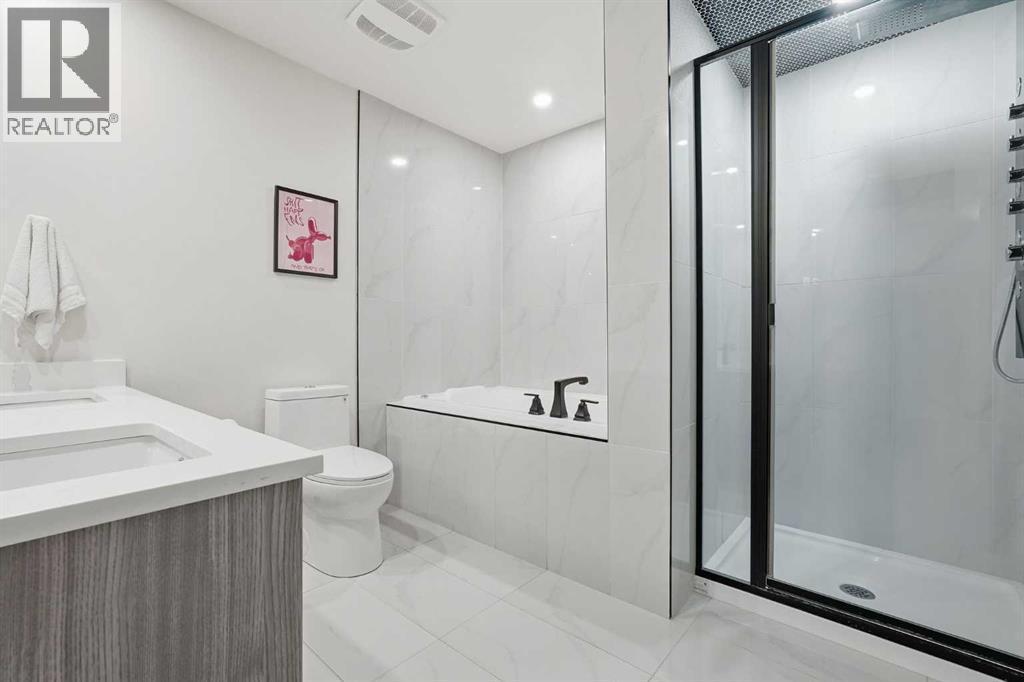 Primary Bedroom with walk in closet and 5pc ensuite - 711 101 Avenue Sw, Calgary, AB - Indoor Photo Showing Bathroom