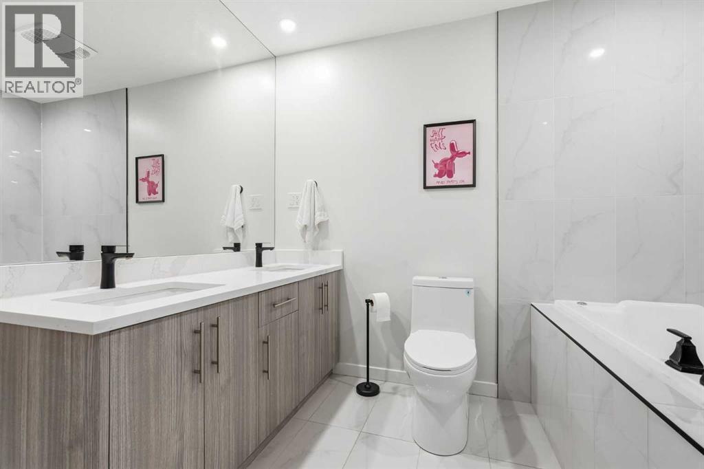 Primary Bedroom with walk in closet and 5pc ensuite - 711 101 Avenue Sw, Calgary, AB - Indoor Photo Showing Bathroom