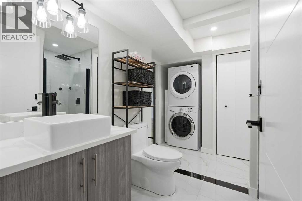 Illegal Suite 1-bed unit with full bathroom and washer and dryer - 711 101 Avenue Sw, Calgary, AB - Indoor Photo Showing Laundry Room