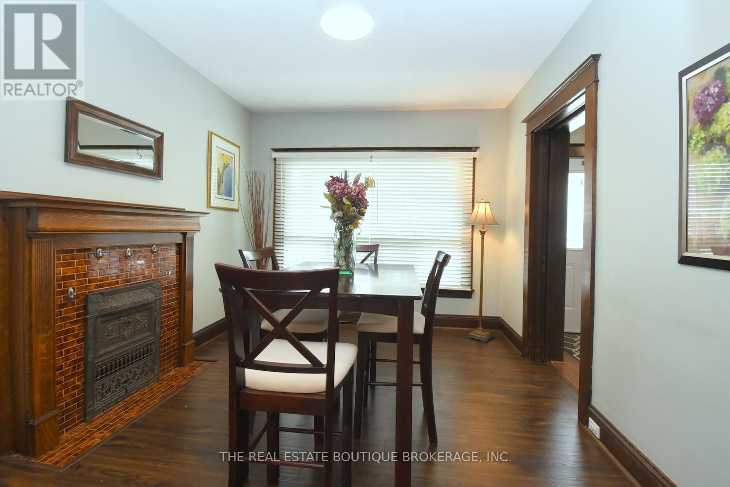 82 Somerset Avenue, Hamilton, ON - Indoor Photo Showing Dining Room With Fireplace