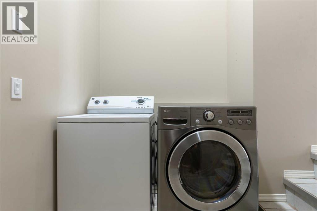 Main floor laundry - 129 Evansbrooke Way Nw, Calgary, AB - Indoor Photo Showing Laundry Room