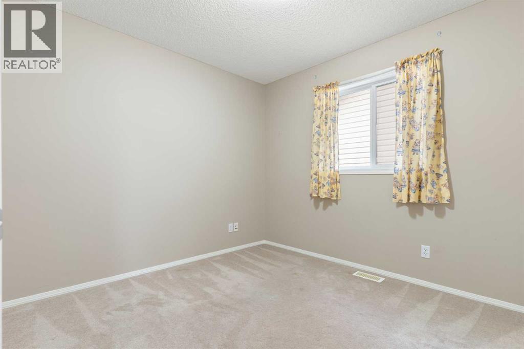 Bedroom 3 - 129 Evansbrooke Way Nw, Calgary, AB - Indoor Photo Showing Other Room