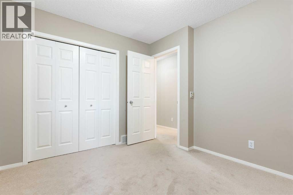 Bedroom 3 - 129 Evansbrooke Way Nw, Calgary, AB - Indoor Photo Showing Other Room