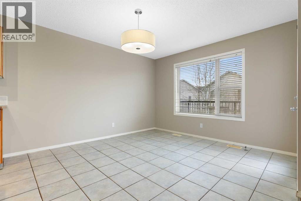 Dining room, tile floor - 129 Evansbrooke Way Nw, Calgary, AB - Indoor Photo Showing Other Room