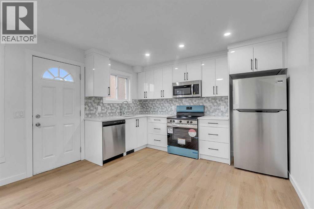63 Penworth Close Se, Calgary, AB - Indoor Photo Showing Kitchen With Stainless Steel Kitchen With Upgraded Kitchen