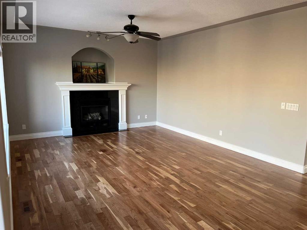 75 Royal Abbey Rise Nw, Calgary, AB - Indoor With Fireplace