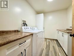 Main floor finished laundry room. -