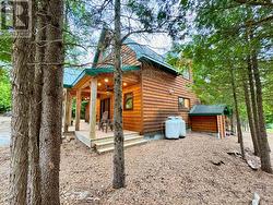 Natural landscaping and year-round tree privacy. -