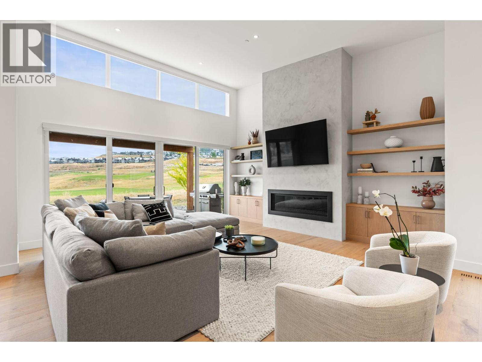 105 Predator Ridge Drive Unit# 22, Vernon, BC - Indoor Photo Showing Living Room With Fireplace