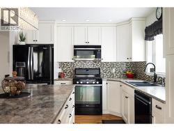 Bright kitchen with lots of cabinets -