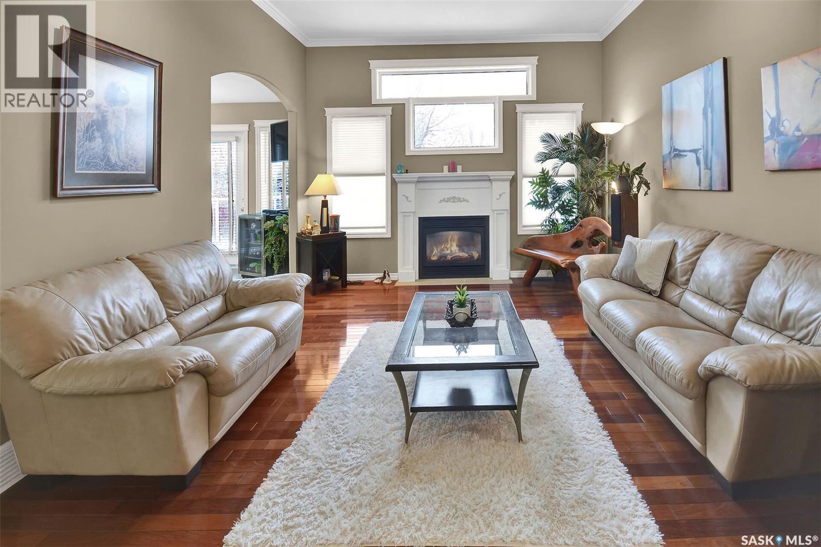 207 Kutz Crescent, Saskatoon, SK - Indoor Photo Showing Living Room With Fireplace