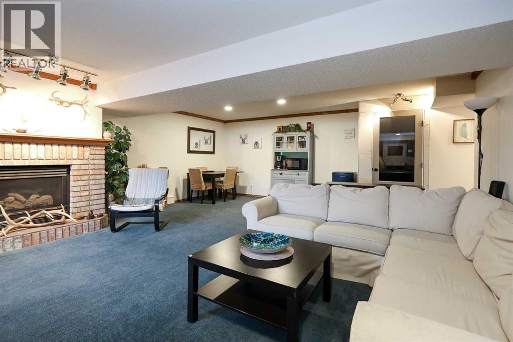 31 Armitage Close, Red Deer, AB - Indoor Photo Showing Living Room With Fireplace