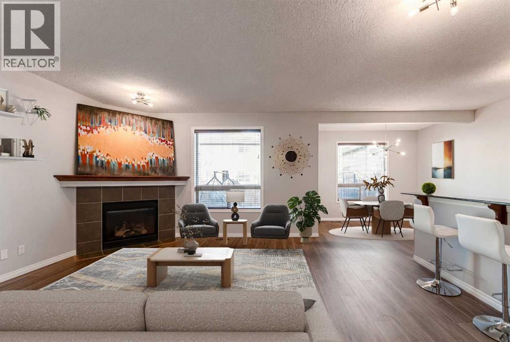 10 Everglen Crescent Sw, Calgary, AB - Indoor Photo Showing Living Room With Fireplace