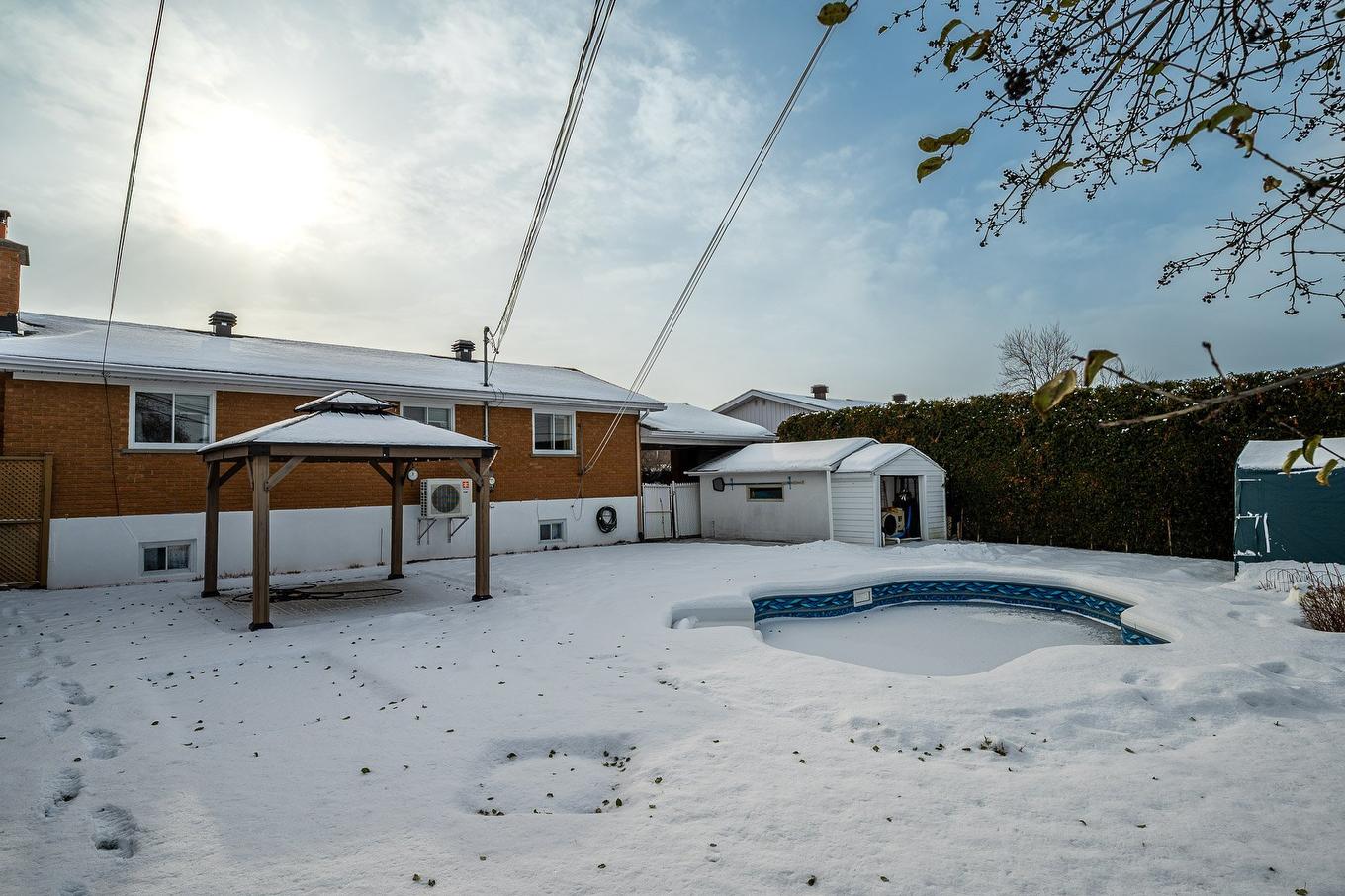 Backyard - 365 Rue Papillon, Laval (Auteuil), QC - Outdoor With In Ground Pool