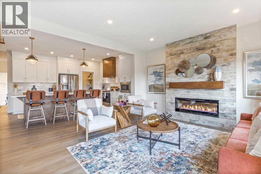 65 Emberside Grove, Cochrane, AB - Indoor Photo Showing Living Room With Fireplace
