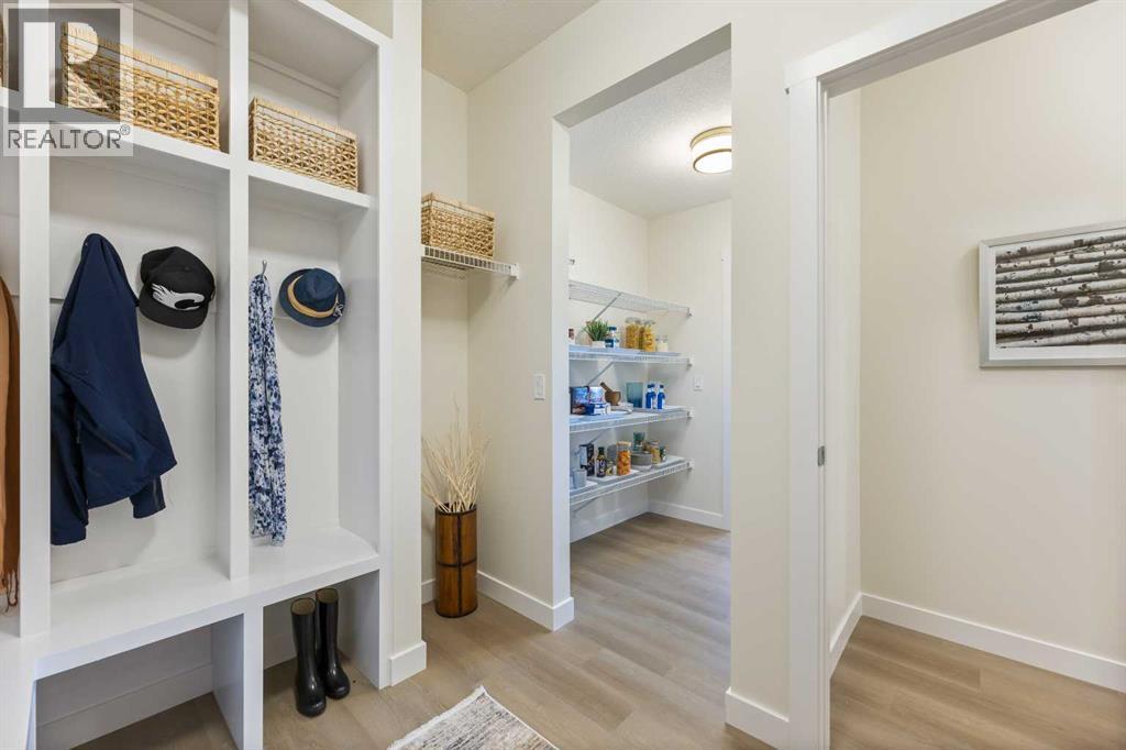 65 Emberside Grove, Cochrane, AB - Indoor Photo Showing Other Room