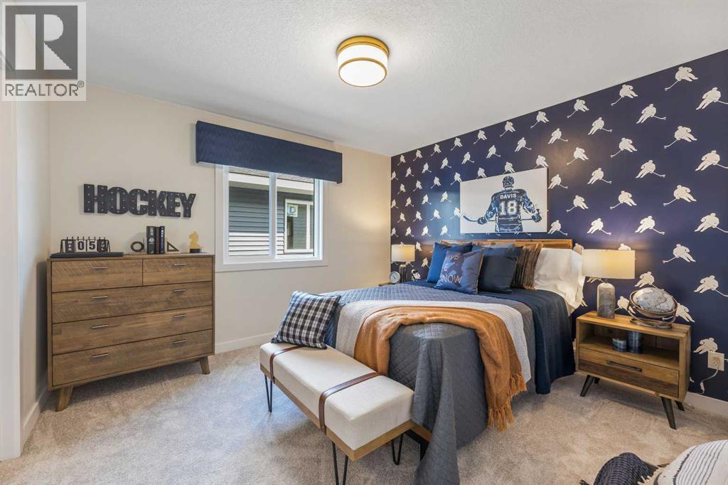 65 Emberside Grove, Cochrane, AB - Indoor Photo Showing Bedroom