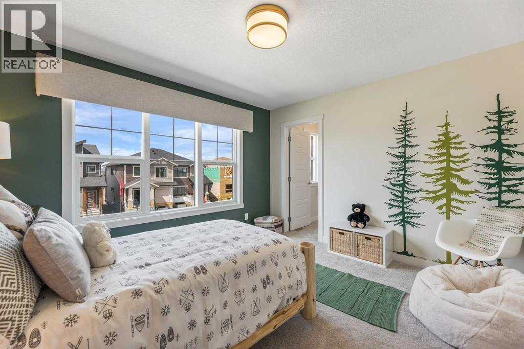 65 Emberside Grove, Cochrane, AB - Indoor Photo Showing Bedroom