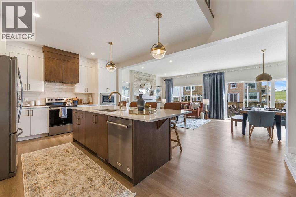 65 Emberside Grove, Cochrane, AB - Indoor Photo Showing Kitchen With Upgraded Kitchen