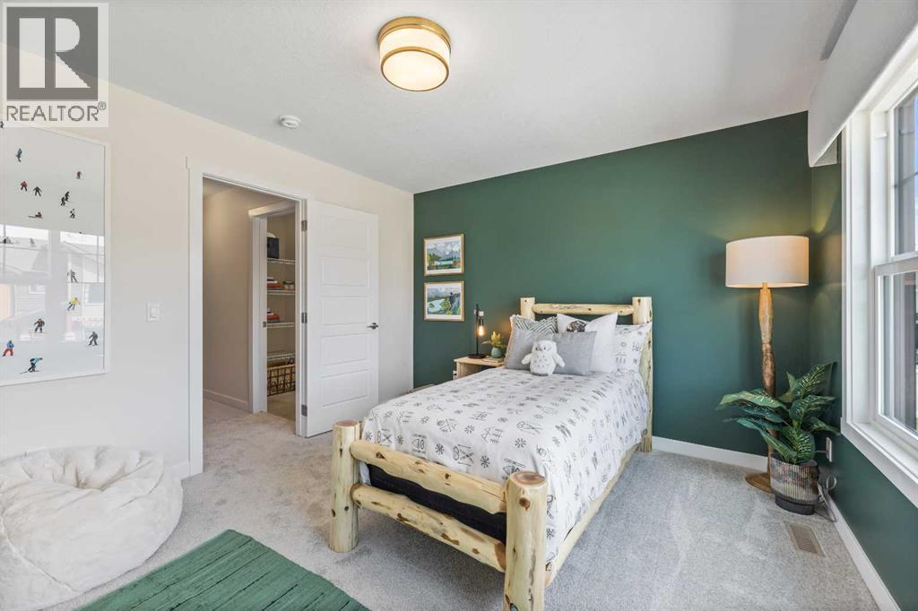 65 Emberside Grove, Cochrane, AB - Indoor Photo Showing Bedroom