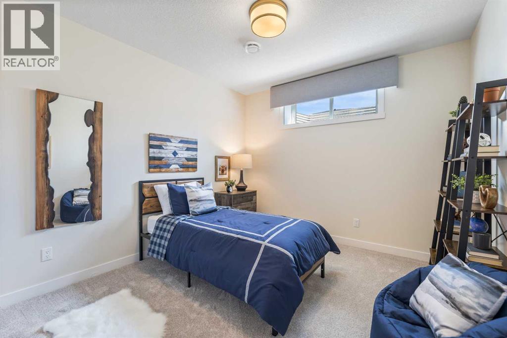 65 Emberside Grove, Cochrane, AB - Indoor Photo Showing Bedroom
