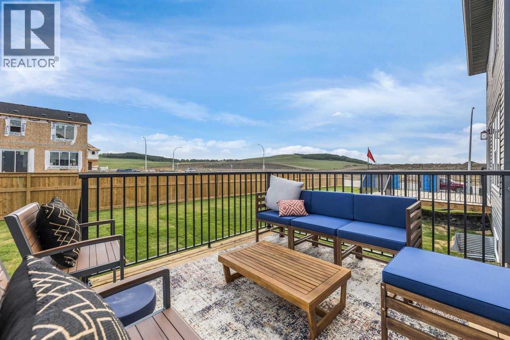 65 Emberside Grove, Cochrane, AB - Outdoor With Deck Patio Veranda With Exterior