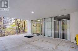 Front entrance to building and ravine to east -