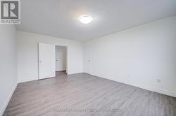 Primary bedroom w/door to walk in & stoage closets -