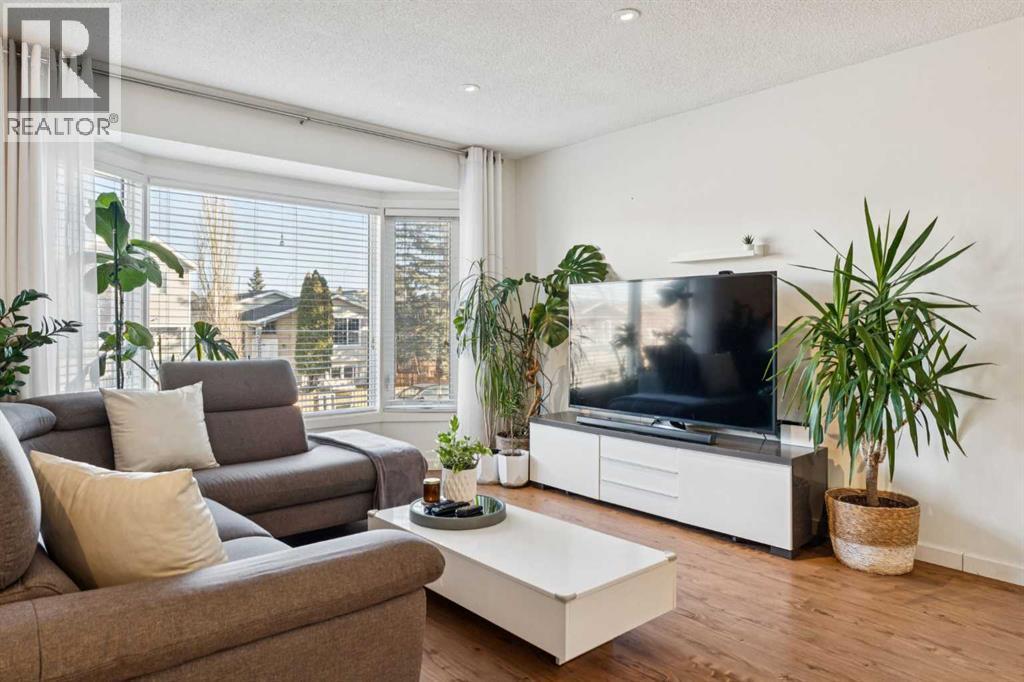 65 Tararidge Close Ne, Calgary, AB - Indoor Photo Showing Living Room