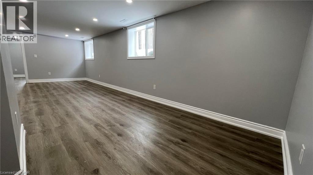 Basement with dark wood-style floors and recessed lighting - 29 Birchcliffe Crescent Unit# 2, Hamilton, ON - Indoor Photo Showing Other Room