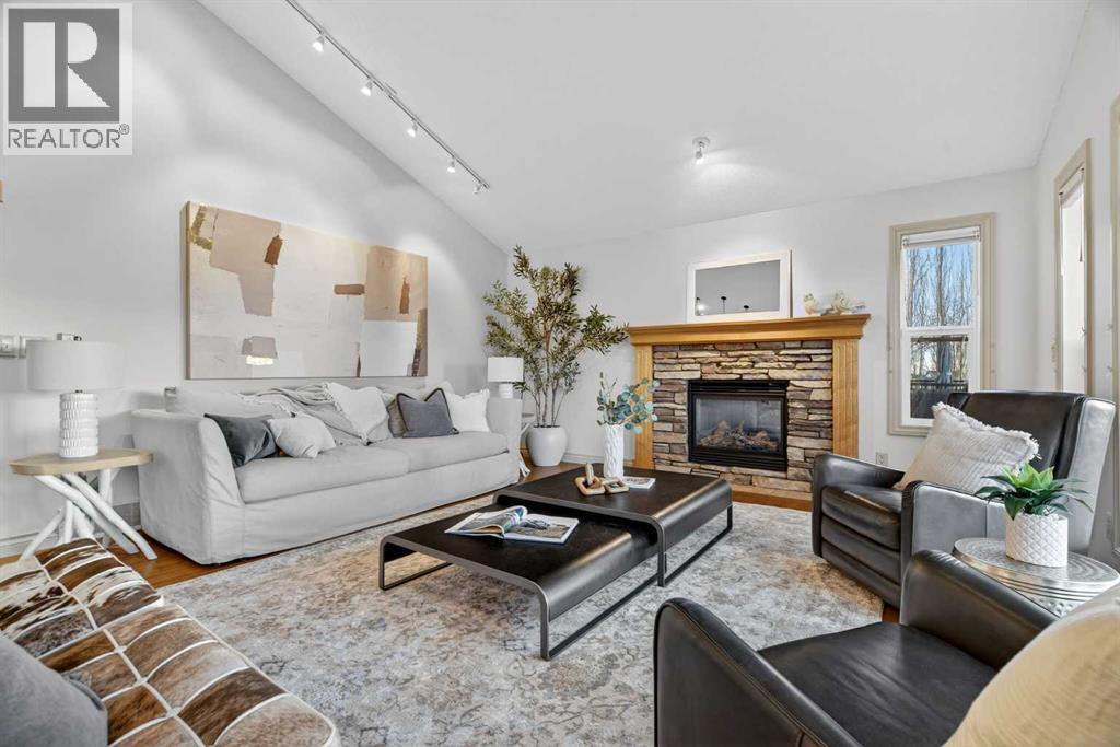 55 Billy Haynes Trail, Okotoks, AB - Indoor Photo Showing Living Room With Fireplace