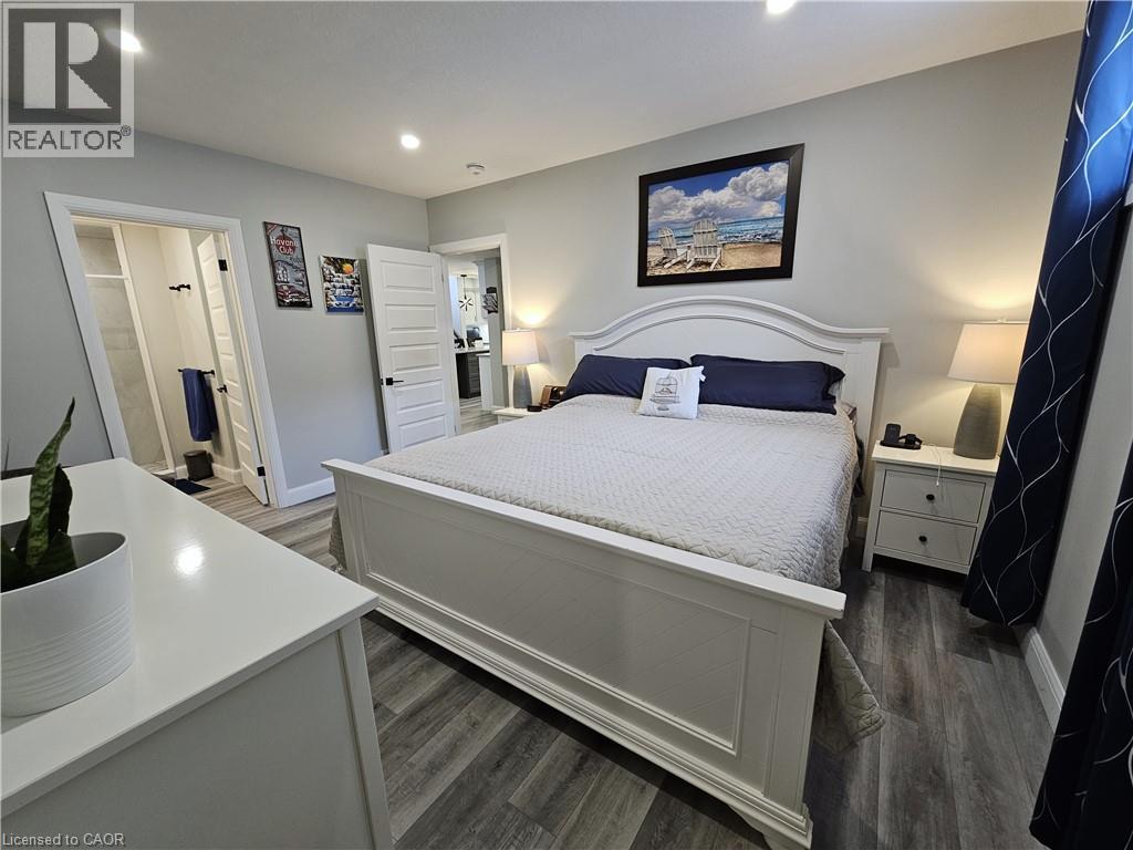 Primary Bedroom in In-Law Suite with walk-in closet & 4pc Ensuite - 46 Stonebridge Place, Simcoe, ON - Indoor Photo Showing Bedroom