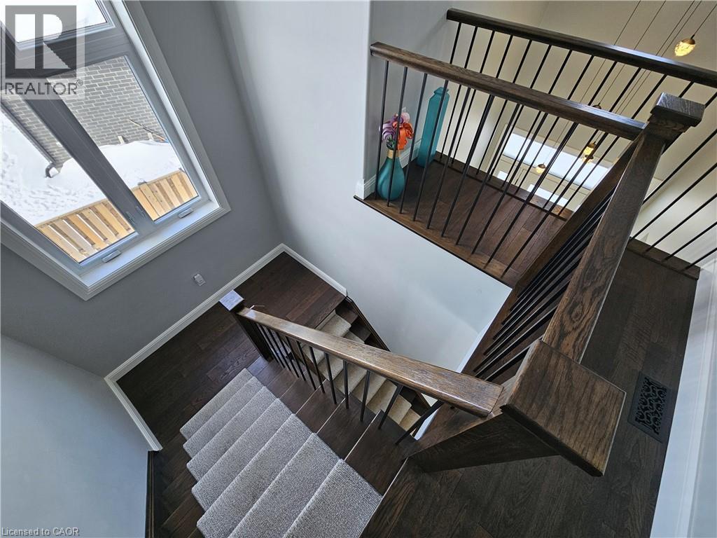 Grand Staircase filled with tons of Natural Light - 46 Stonebridge Place, Simcoe, ON - Indoor Photo Showing Other Room