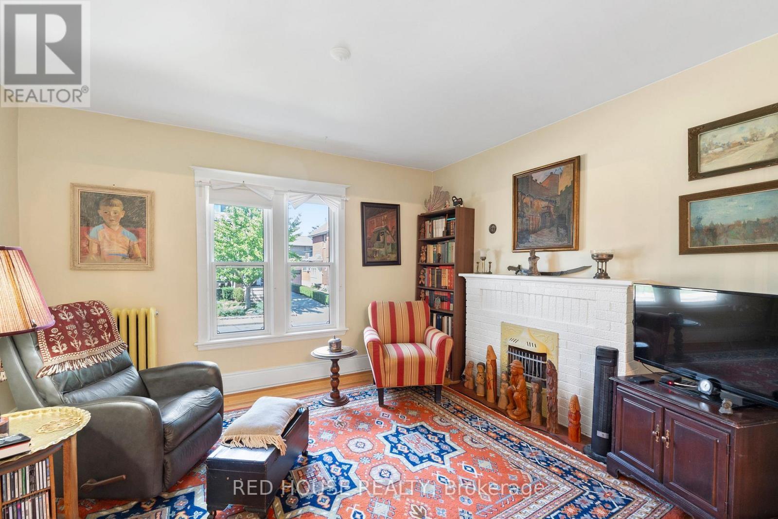 unit 3 living - 55 Balsam Avenue S, Hamilton, ON - Indoor Photo Showing Living Room With Fireplace