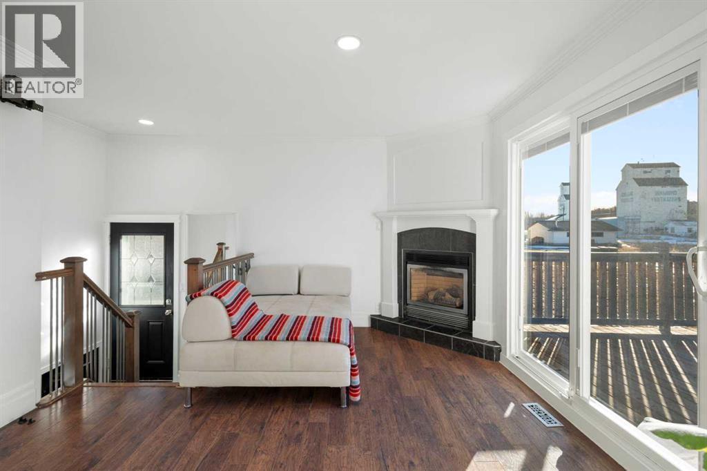 111 Macleod Trail E, Rural Foothills County, AB - Indoor With Fireplace