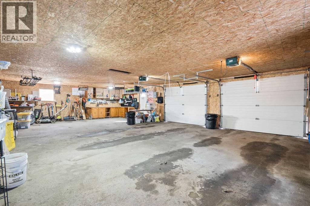 MASSIVE DOUBLE GARAGE - 111 Macleod Trail E, Rural Foothills County, AB - Indoor Photo Showing Garage