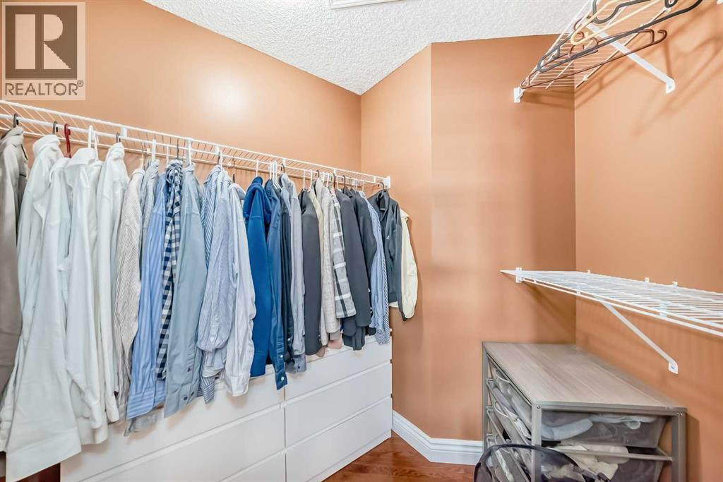 Master bed walkin closet - 188 Hidden Ranch Crescent Nw, Calgary, AB - Indoor With Storage