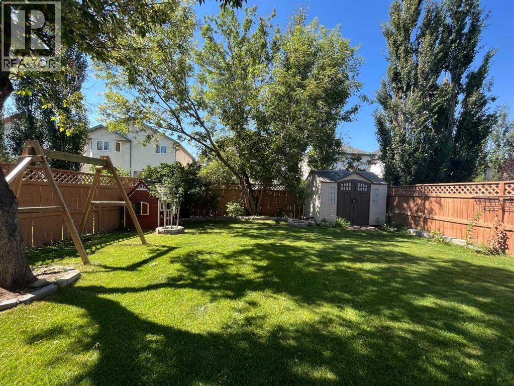 Mature Trees with enhanced privacy - 188 Hidden Ranch Crescent Nw, Calgary, AB - Outdoor With Backyard