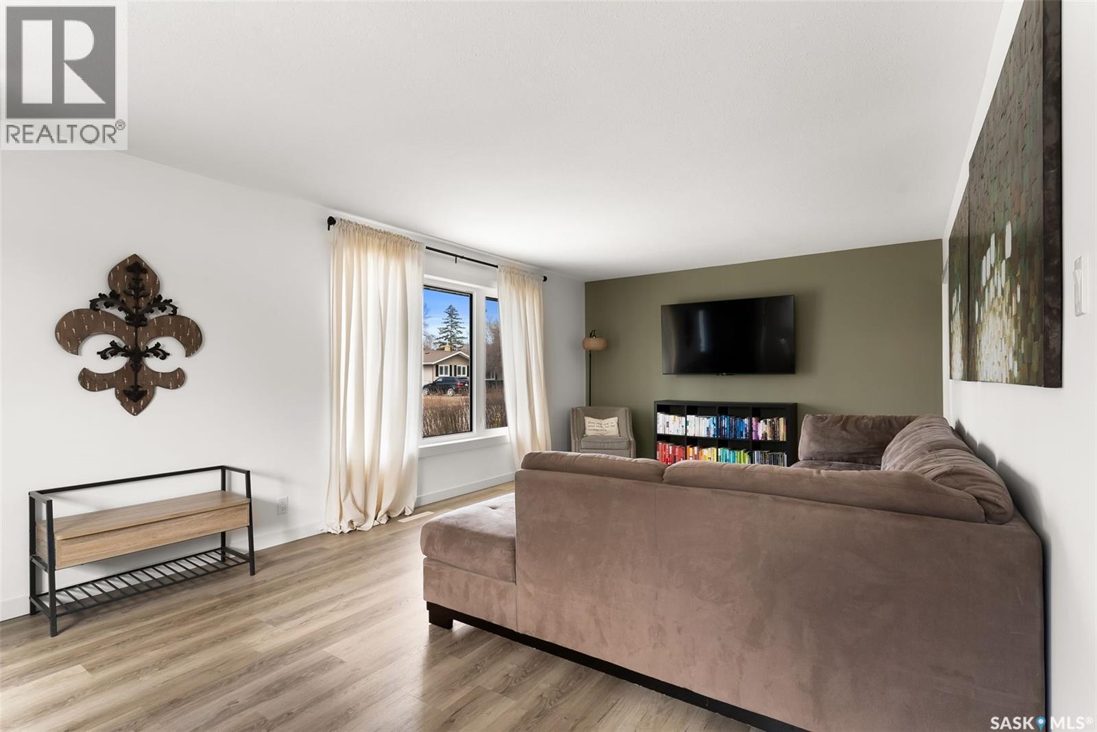 73 Coldwell Road, Regina, SK - Indoor Photo Showing Living Room With Fireplace