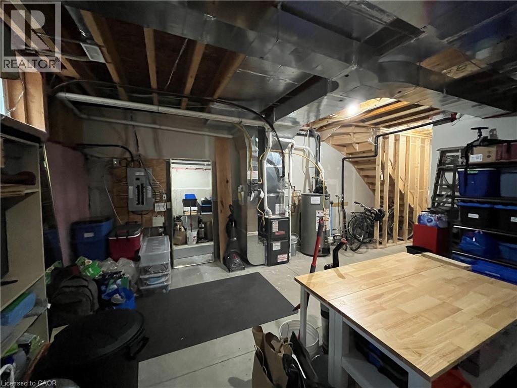 unfinished utility/storage area off of main floor entrance (old photo) - 352 Louisa Street, Kitchener, ON - Indoor Photo Showing Basement