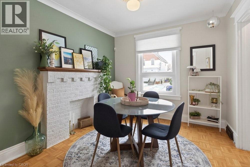 19 Huxley Avenue N, Hamilton, ON - Indoor Photo Showing Dining Room With Fireplace