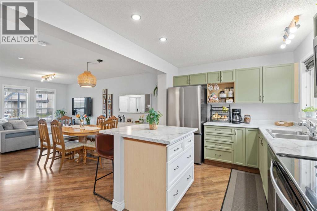 242 Elgin Place Se, Calgary, AB - Indoor Photo Showing Kitchen With Double Sink With Upgraded Kitchen