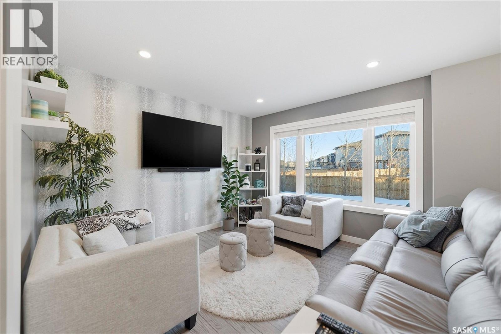 222 Newton Link, Saskatoon, SK - Indoor Photo Showing Living Room With Fireplace