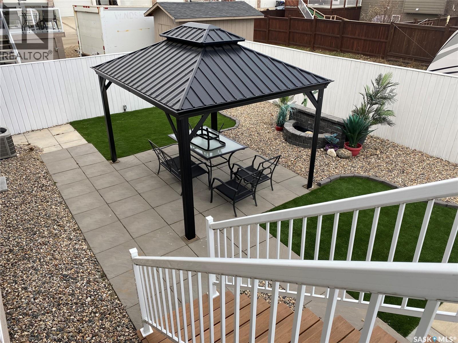 404 Lyle Crescent, Warman, SK - Outdoor With Deck Patio Veranda With Exterior