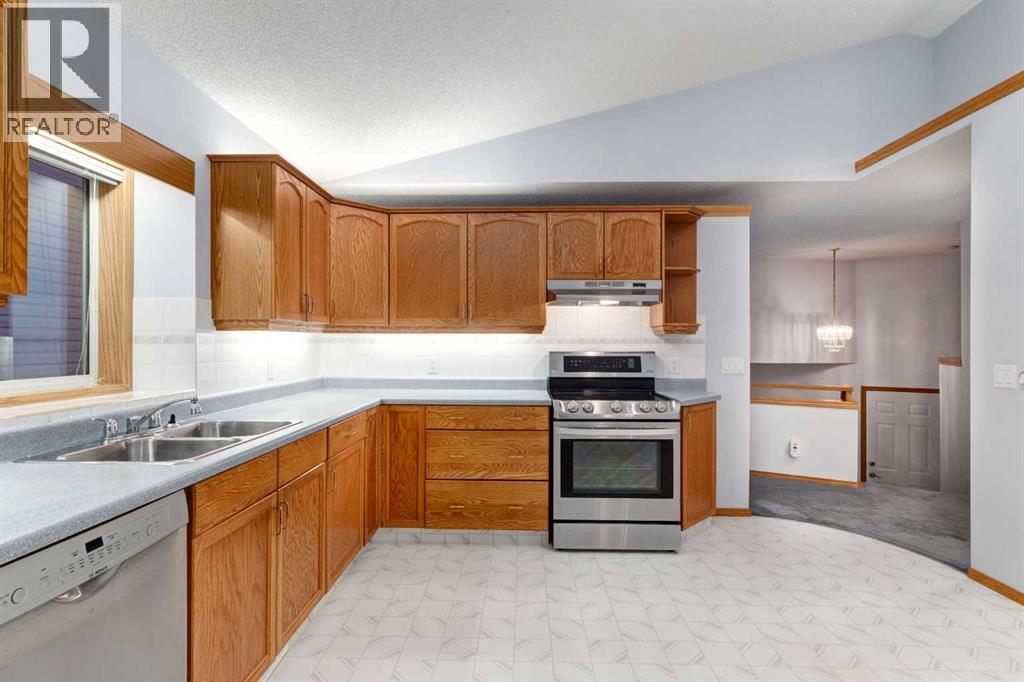 20 Willowbrook Gate Nw, Airdrie, AB - Indoor Photo Showing Kitchen With Double Sink