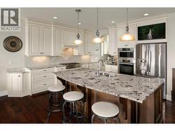 built in TV above the fridge -